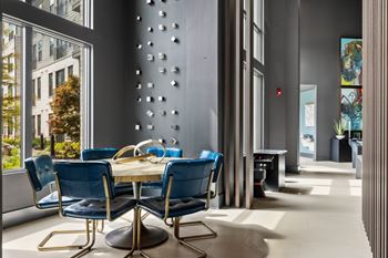 Gaming lounge with billiards, foosball, shuffleboard, and vintage arcade games